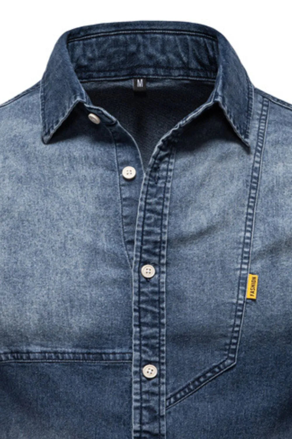 Blue denim button-down shirt close-up with pointed collar, button placket, and chest pocket