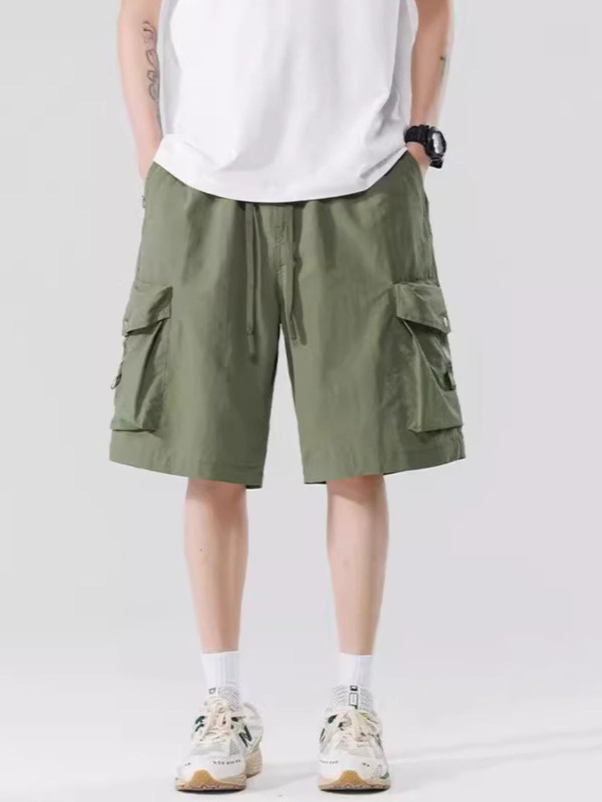 Men's relaxed cargo shorts in military green, drawstring waist and side cargo pockets