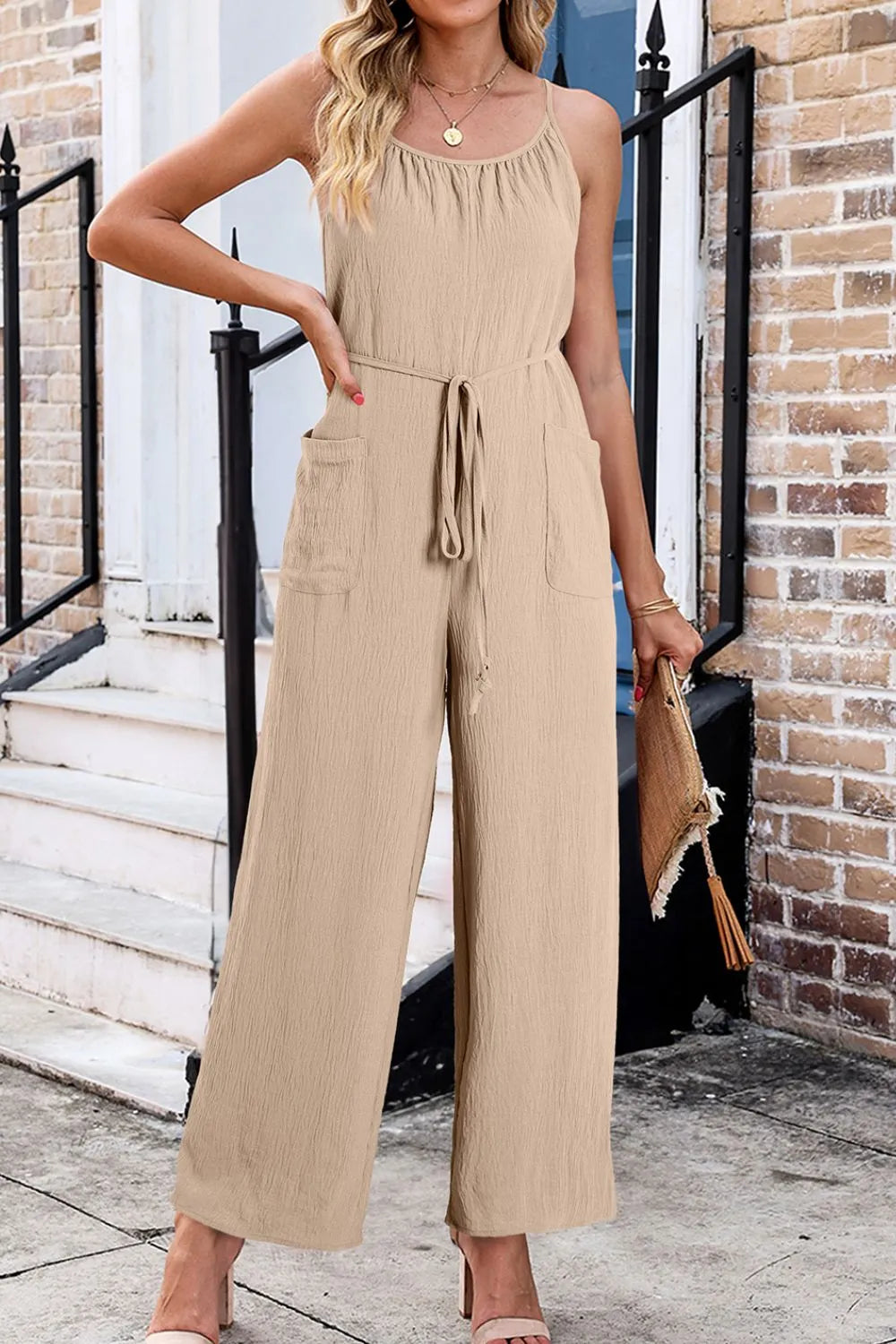 Khaki spaghetti strap wide-leg jumpsuit with drawstring waist and side pockets