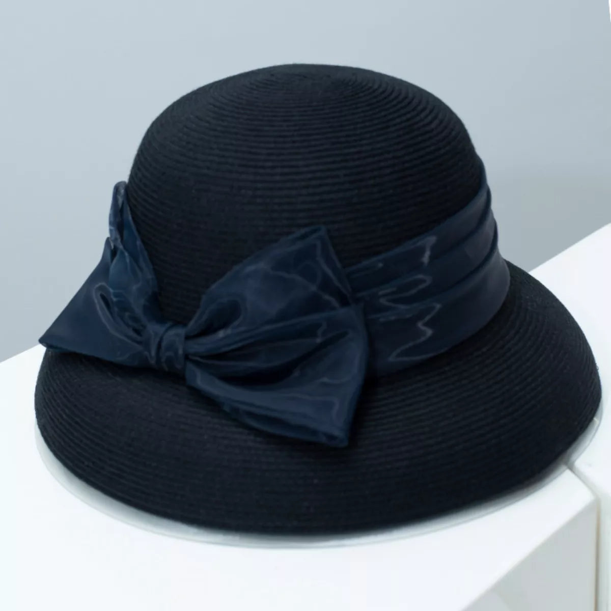 Cedar & Moore Ribbon Bow Straw Sun Hat in black with navy bow