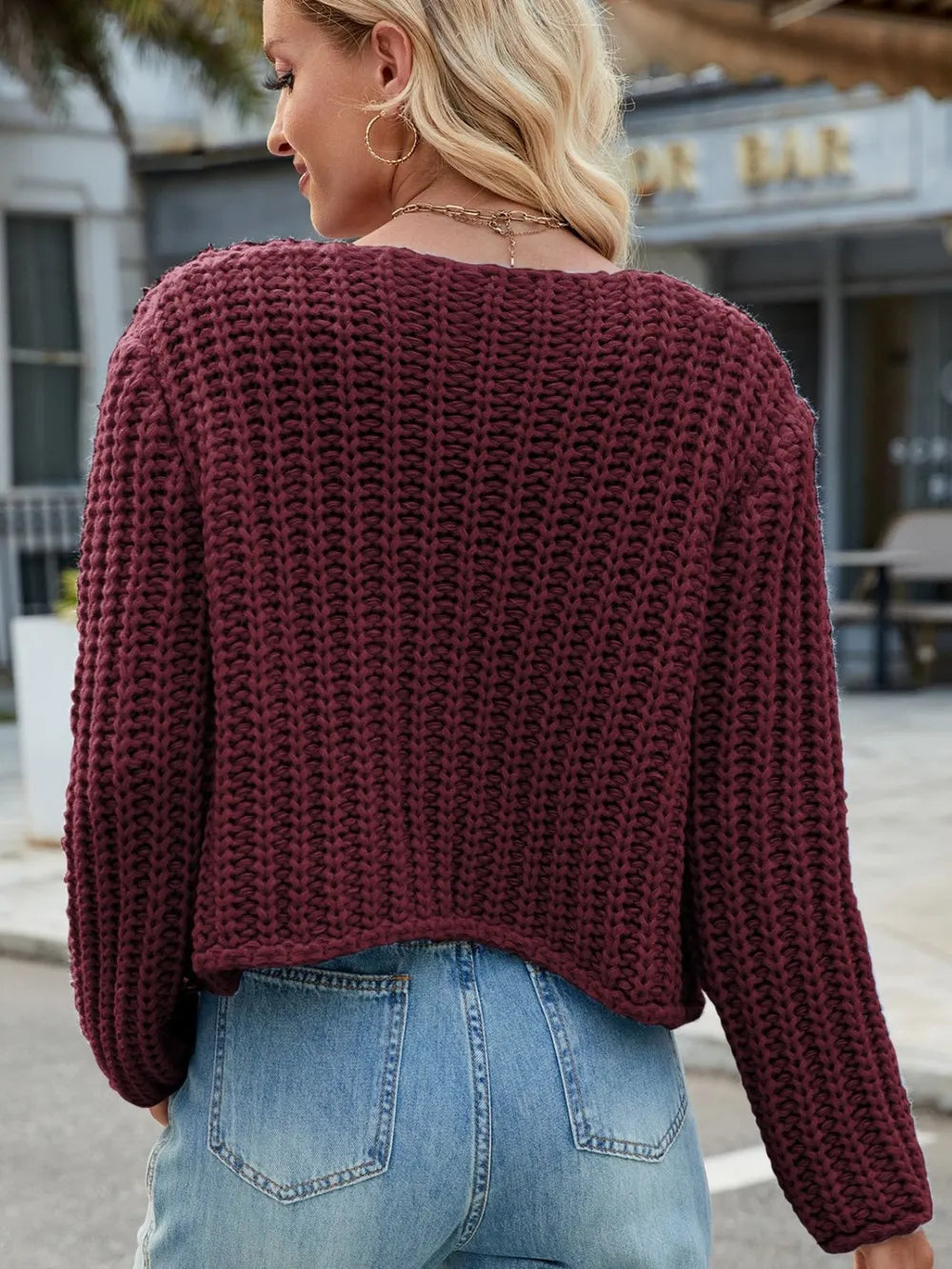 Burgundy knit cardigan back view with long sleeves and round neckline