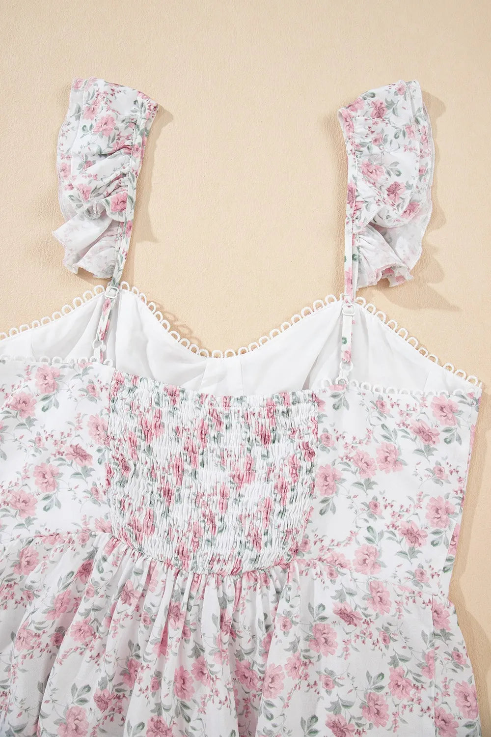 Floral peplum tank top front view with blush pink floral print and lace-trim straps