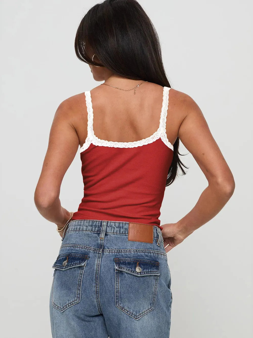 Back view of deep red cropped lace-trim cami with thin straps.