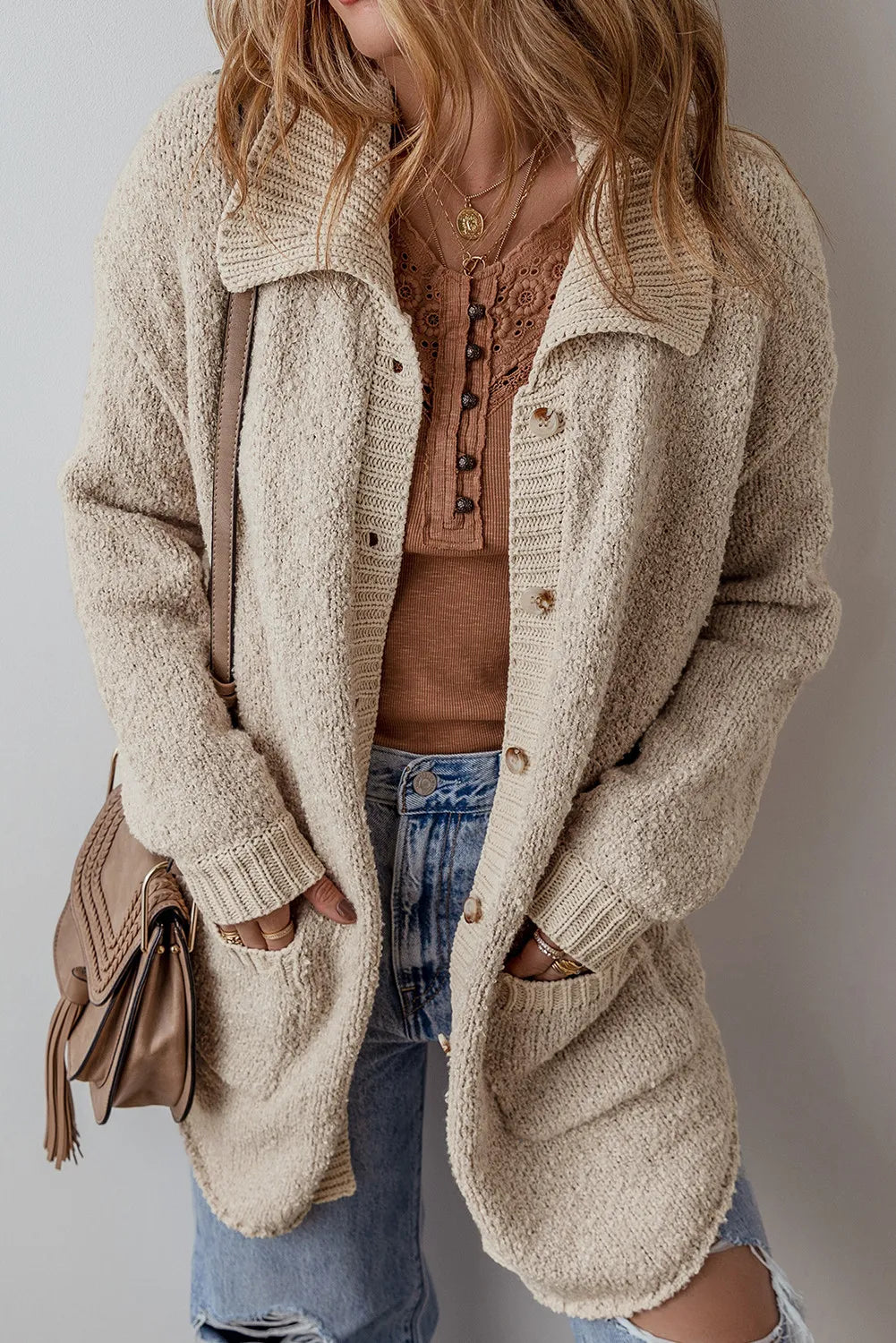 Dust Storm long sleeve button cardigan with patch pockets, worn open at front