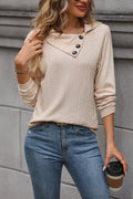 Tan long-sleeve button henley top with cable-knit texture, split collar