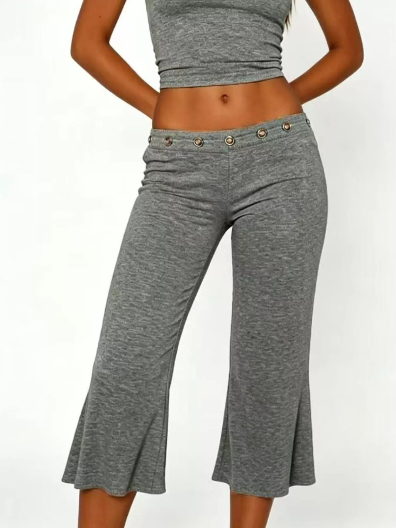 Mid-rise capri pants in heather gray, button-front eyelet waistband detail, flared legs.