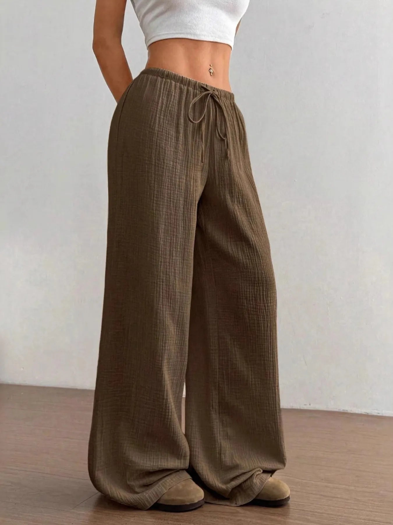 Mocha brown wide-leg drawstring pants with elastic waistband and draped legs
