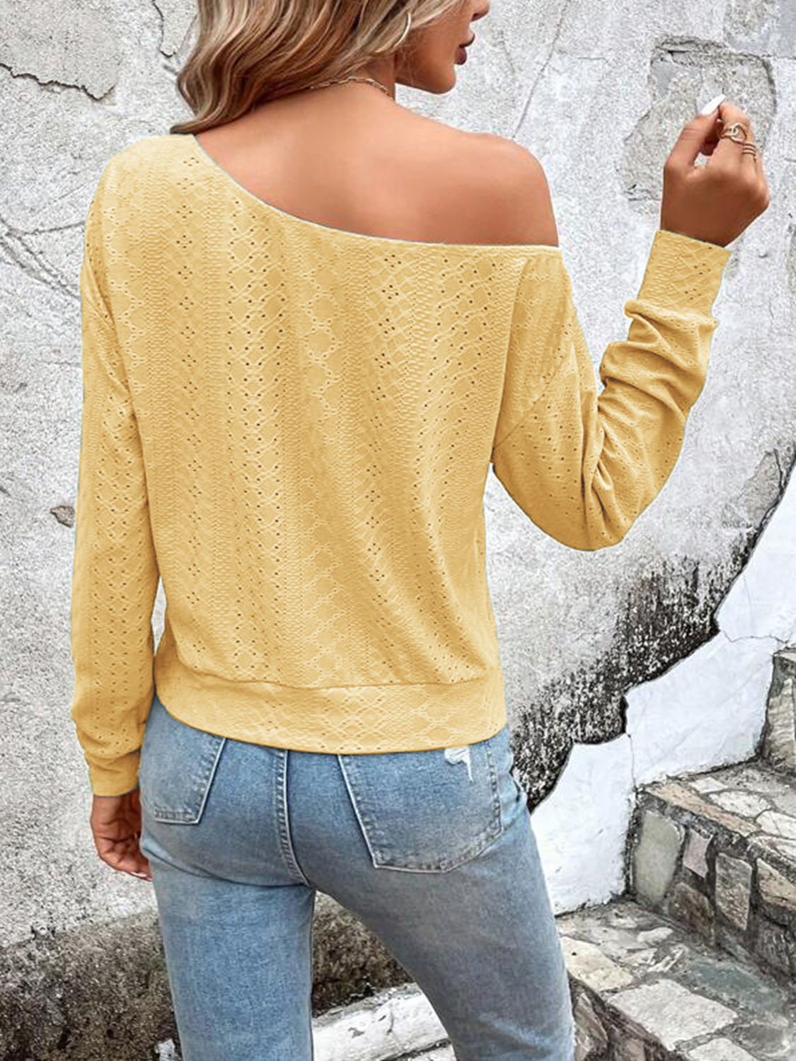 Yellow eyelet blouse, back view with dropped shoulders and long sleeves