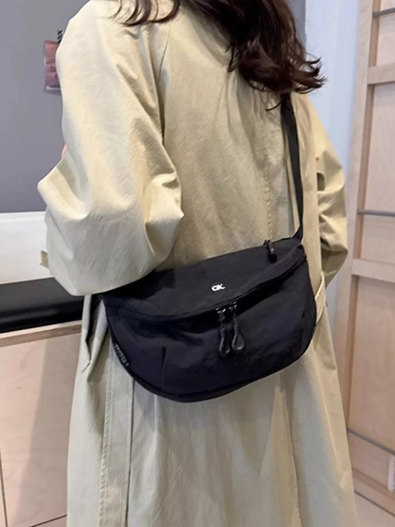 Lightweight nylon crossbody bag, black, medium, with front dual-zip pocket and small logo on flap