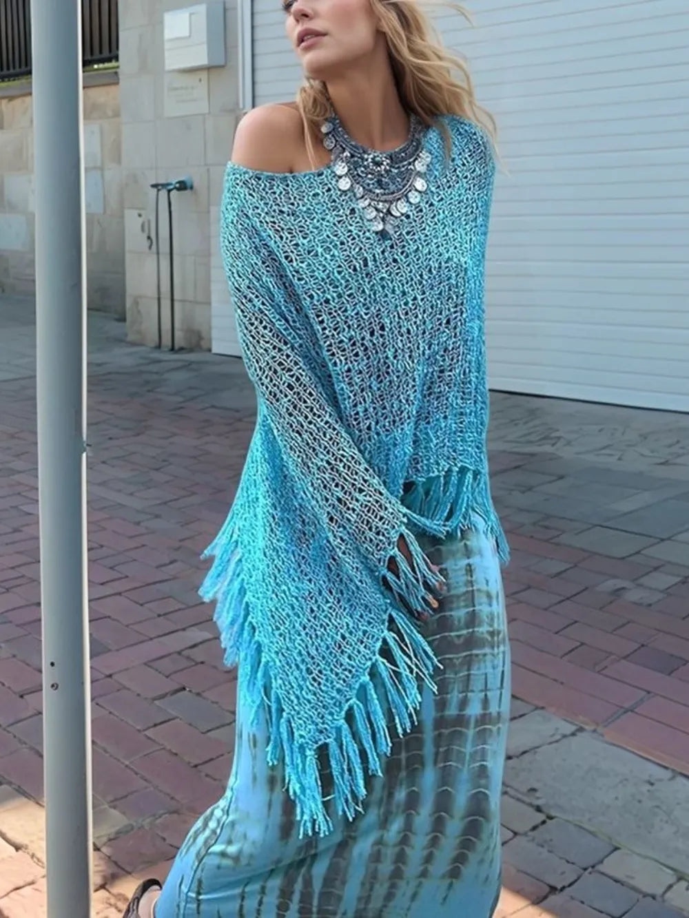 Sky blue open-knit shawl with boat neck and long fringe tassels