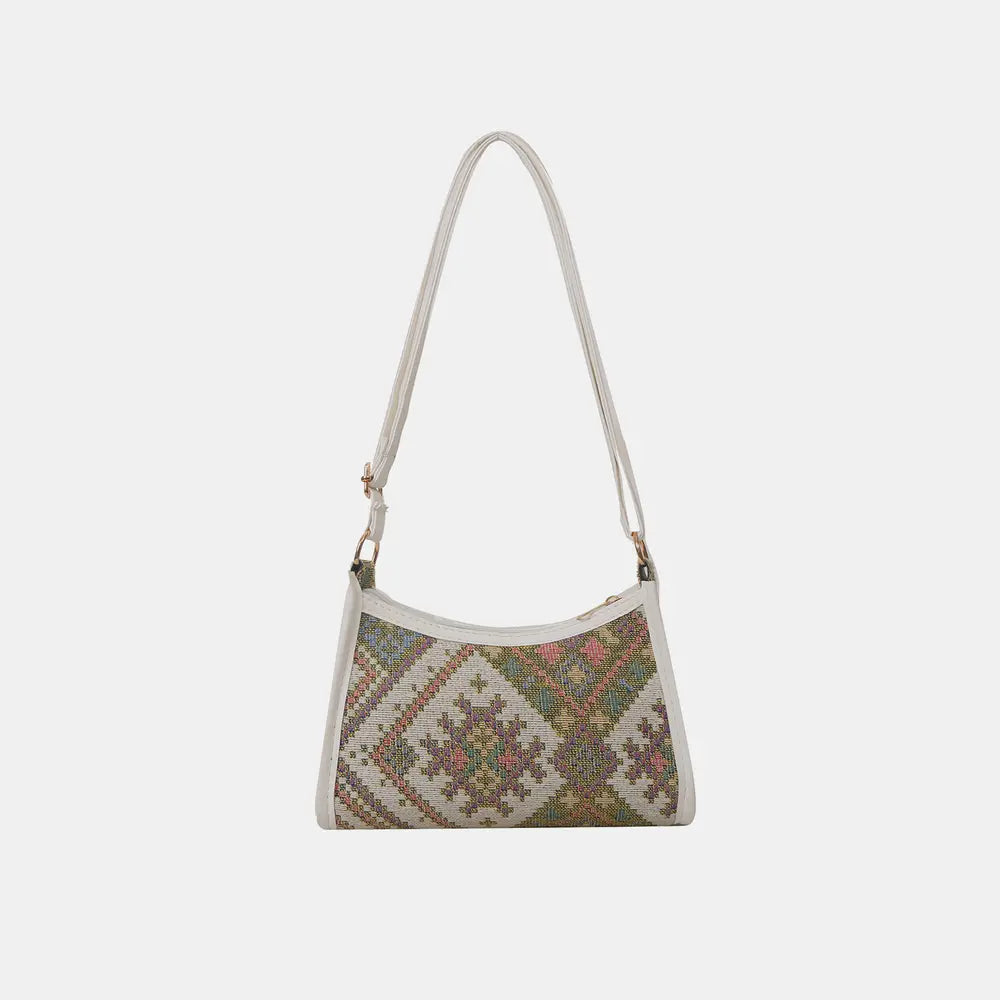 Geometric crossbody bag in light/white with multicolor diamond pattern and top zip