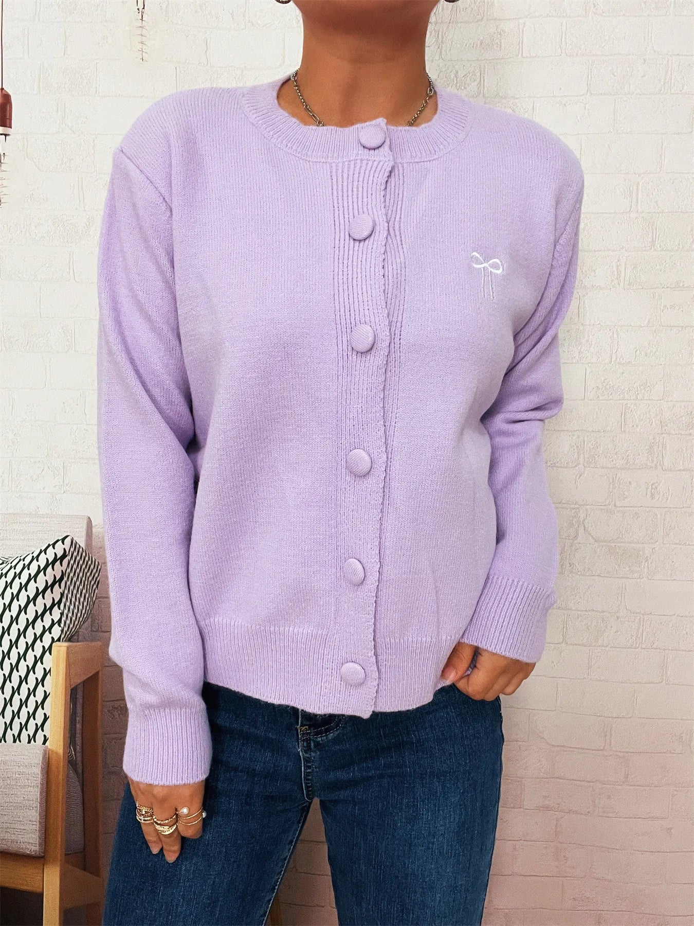 Lavender button-up long sleeve cardigan with knit fabric and button front.