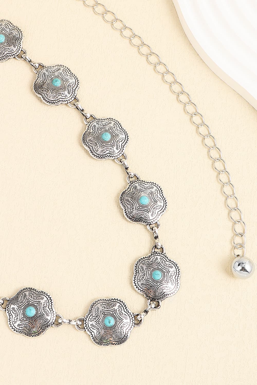 Vintage turquoise alloy belt close-up of scalloped turquoise inlay medallions on chain