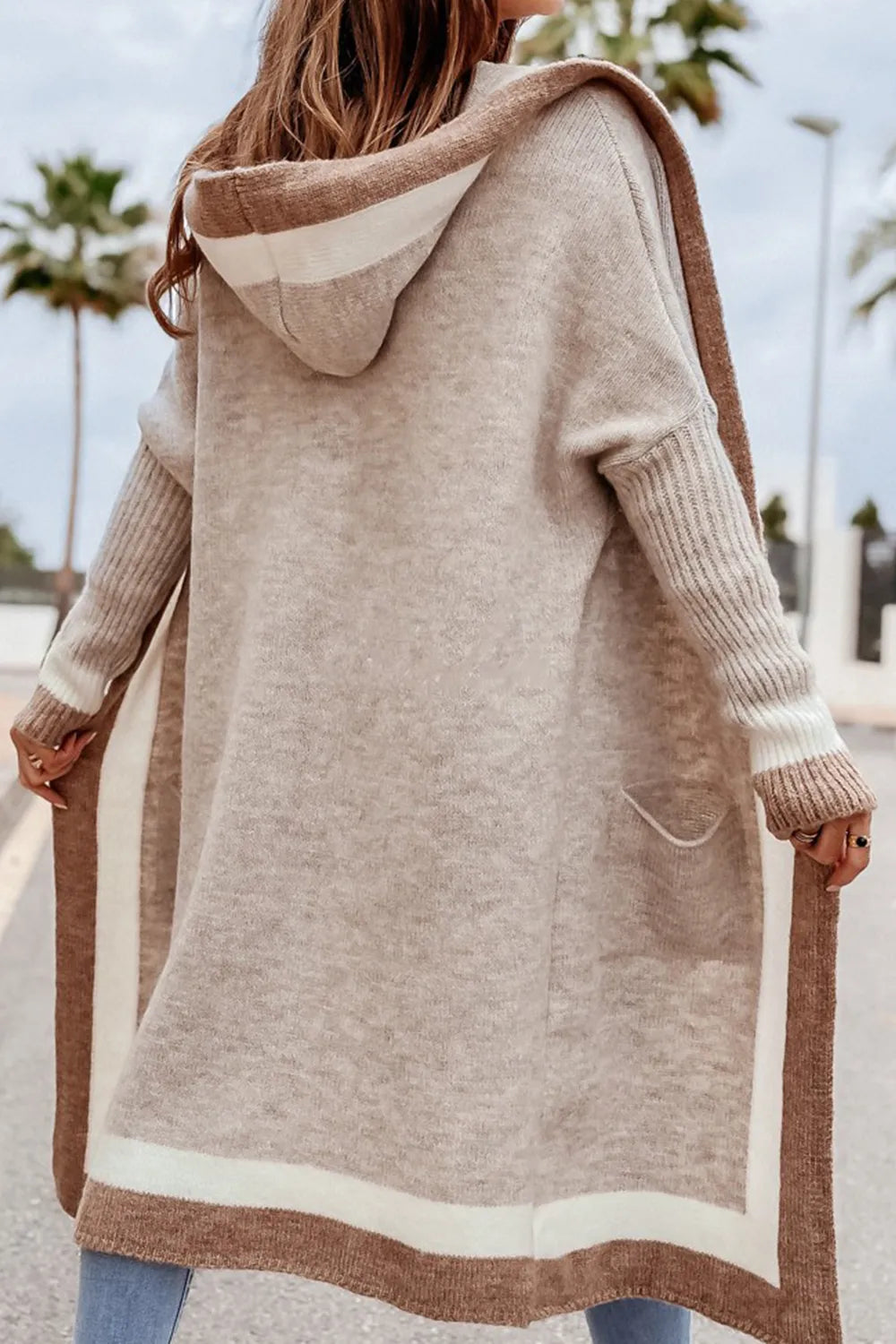 Back view long hooded cardigan with contrast trim and front patch pocket in light taupe