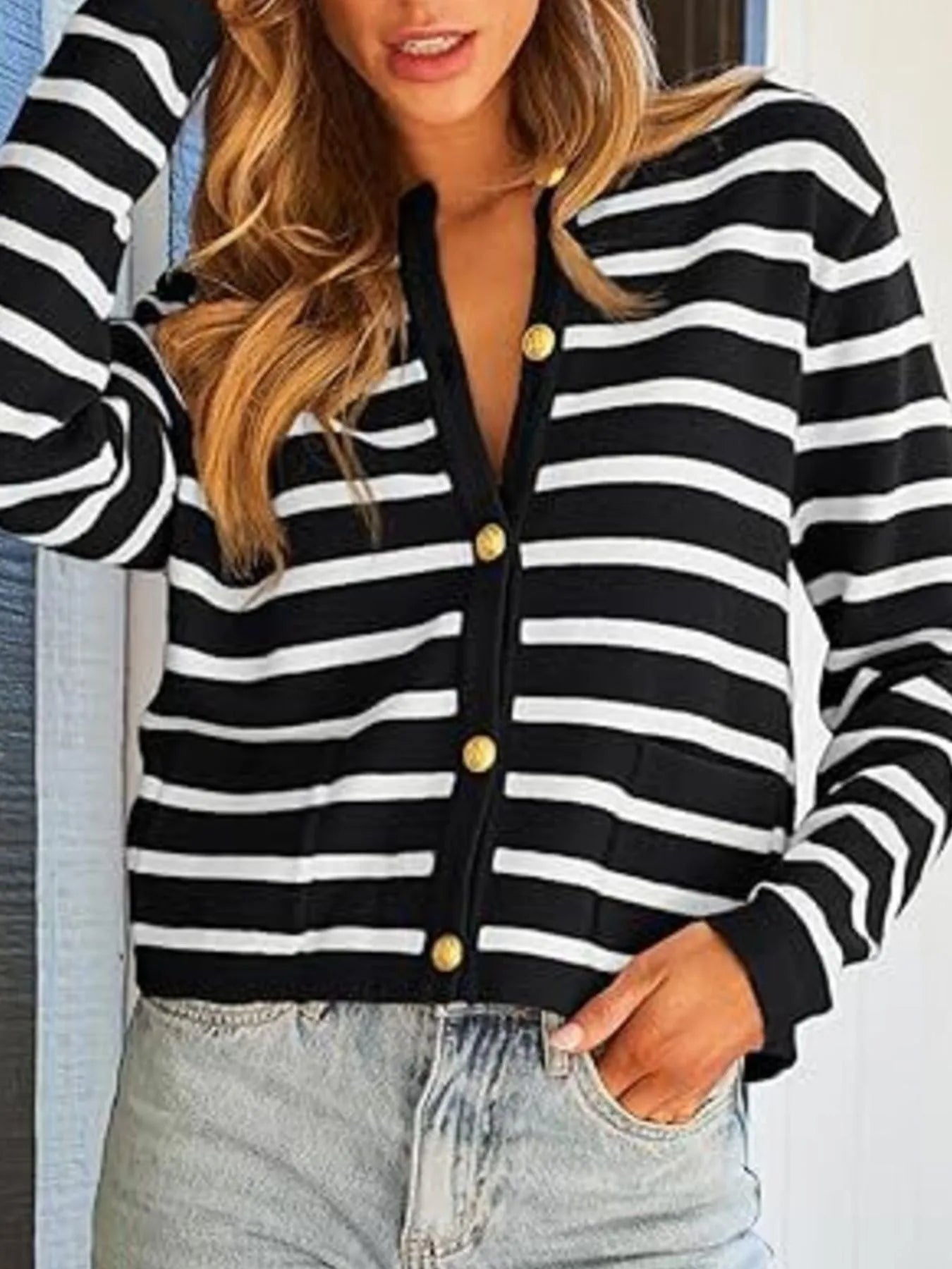 Black and white striped button-up cardigan with gold buttons and V neckline