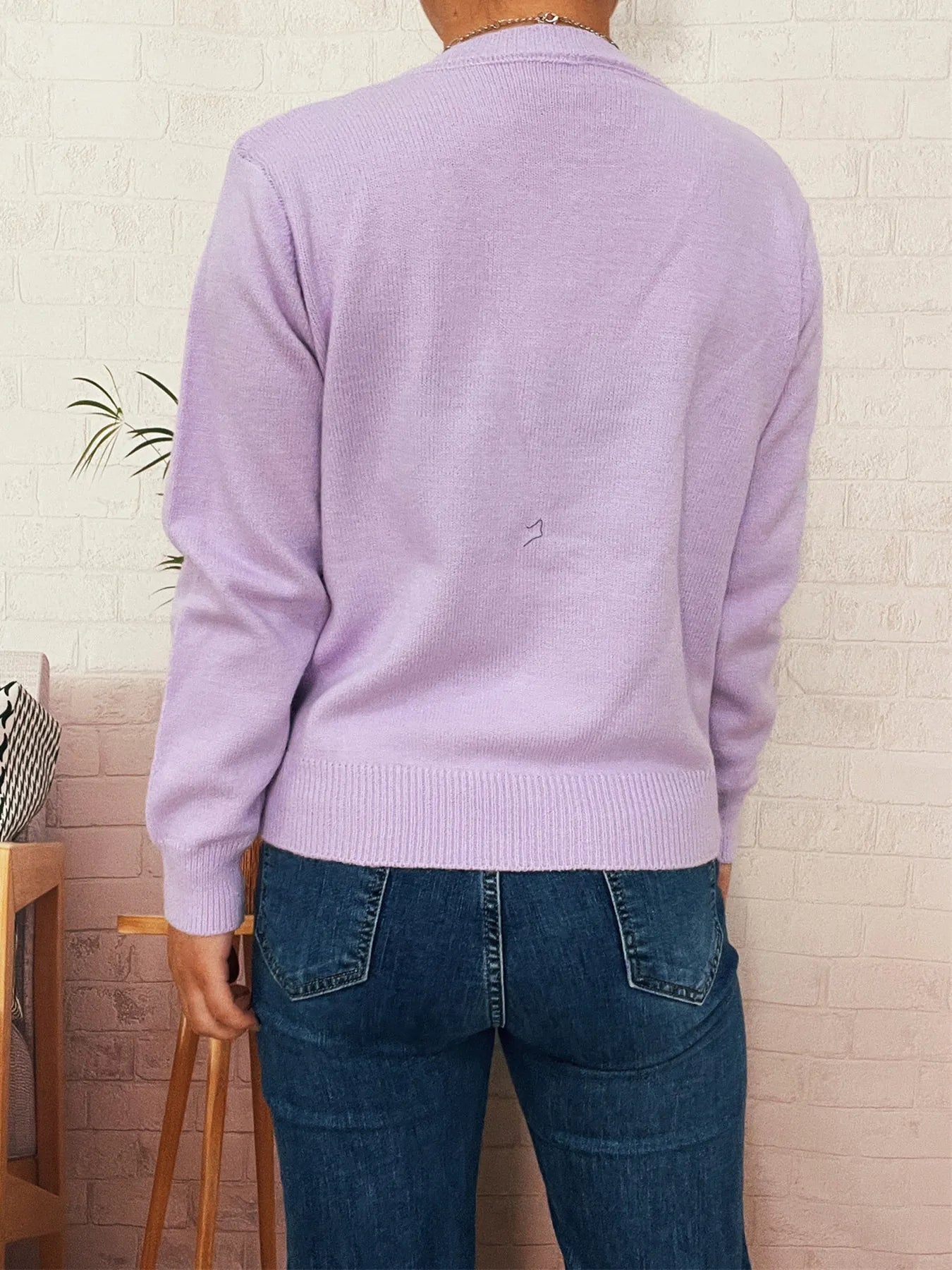 Lavender button-up cardigan back view with long sleeves and knit texture