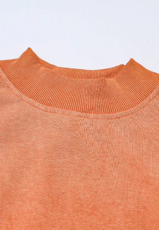 Orange mock neck sweatshirt, ribbed collar and textured knit