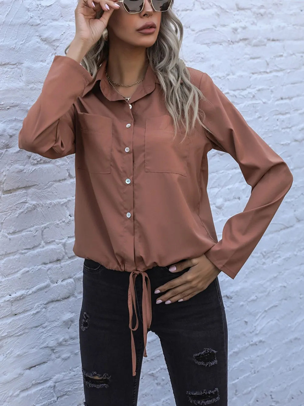 Caramel long-sleeve button down shirt with tied hem and chest pocket, button front
