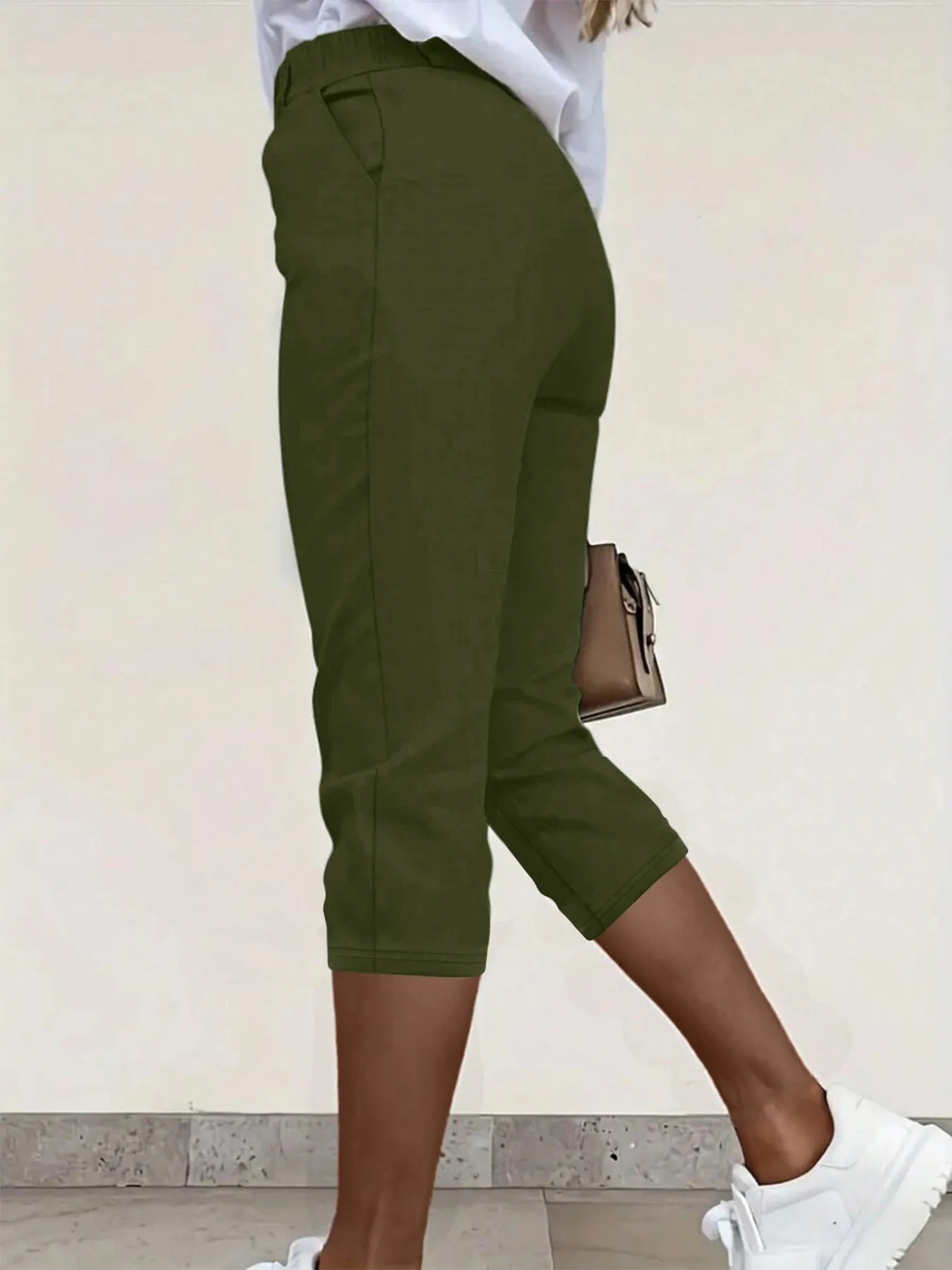 Olive green pleated detail pants with pockets, cropped hem and cuffed ankle length