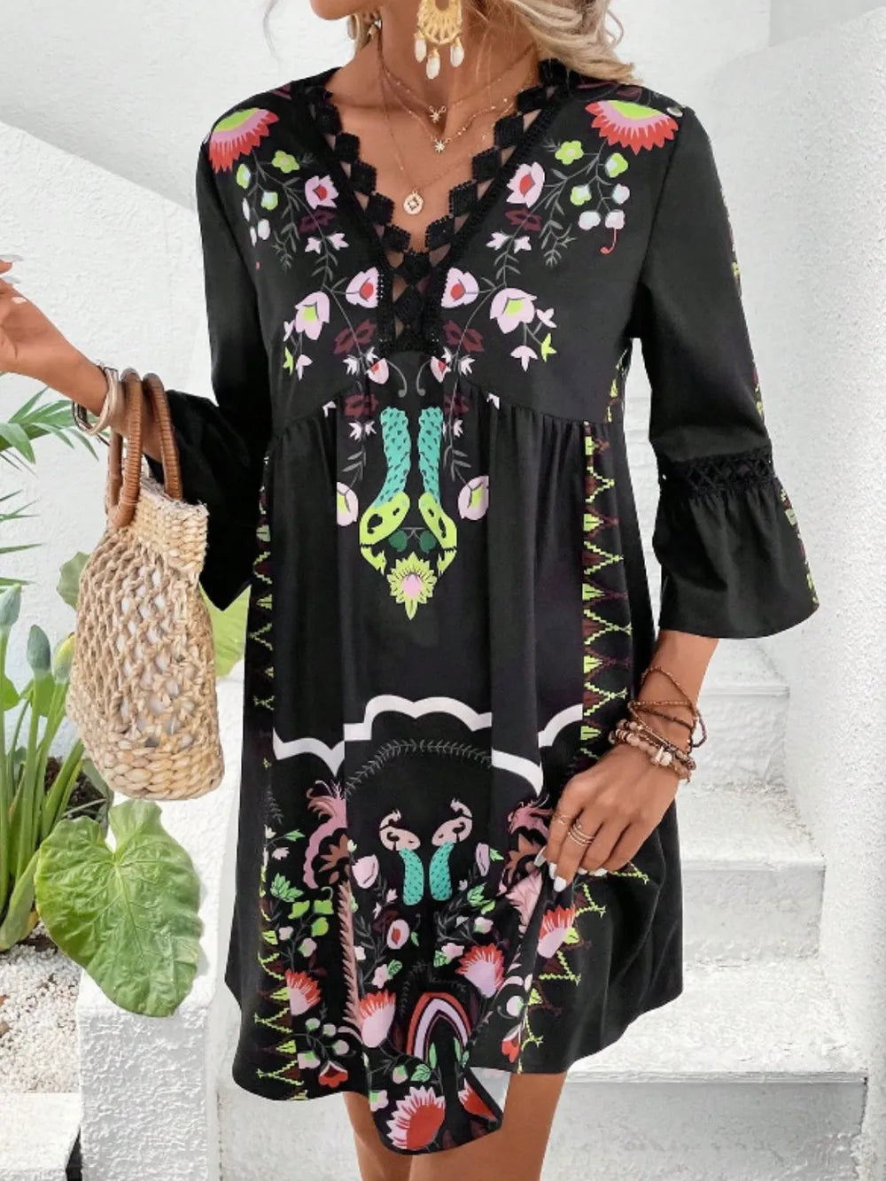 Black printed lace-trim three-quarter sleeve dress with V neckline and flared skirt