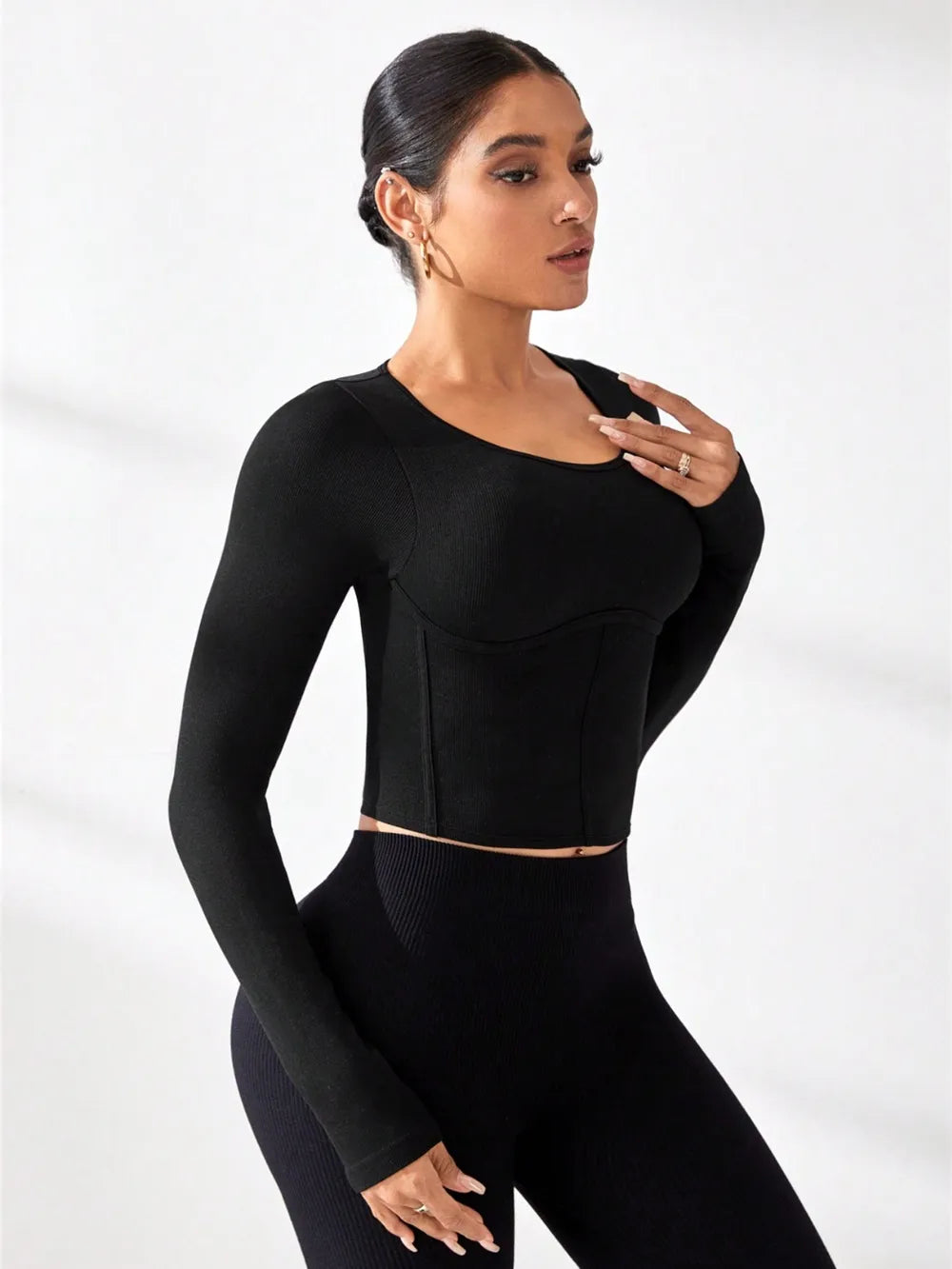 Black round-neck long-sleeve active t-shirt, fitted front panel, cropped