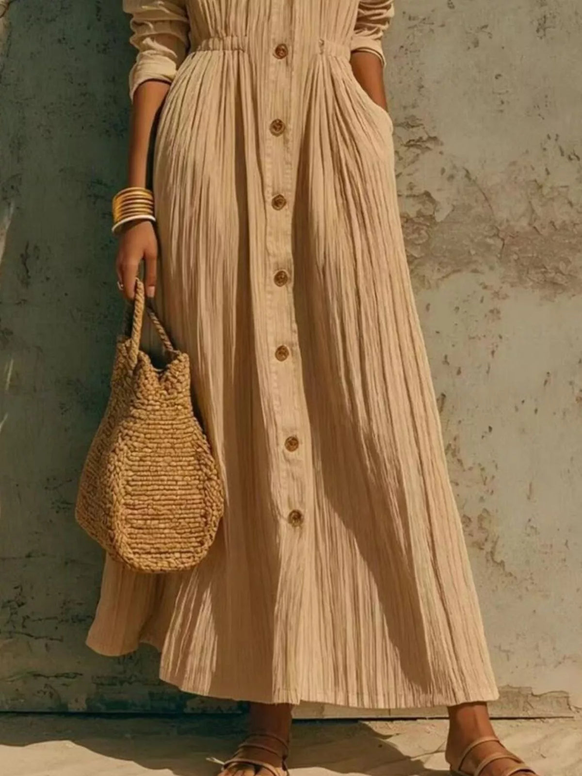 Beige button-front maxi shirt dress with long sleeves, pleated skirt and front buttons