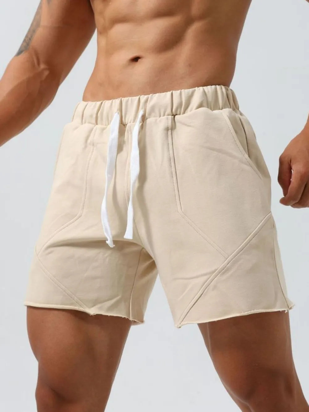 Men's plus-size drawstring elastic waist shorts, light beige, front pocket detail