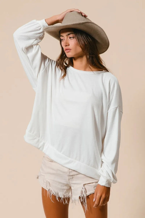 Ivory crewneck terry pull-over, long sleeves, relaxed fit; raw cut hem edge