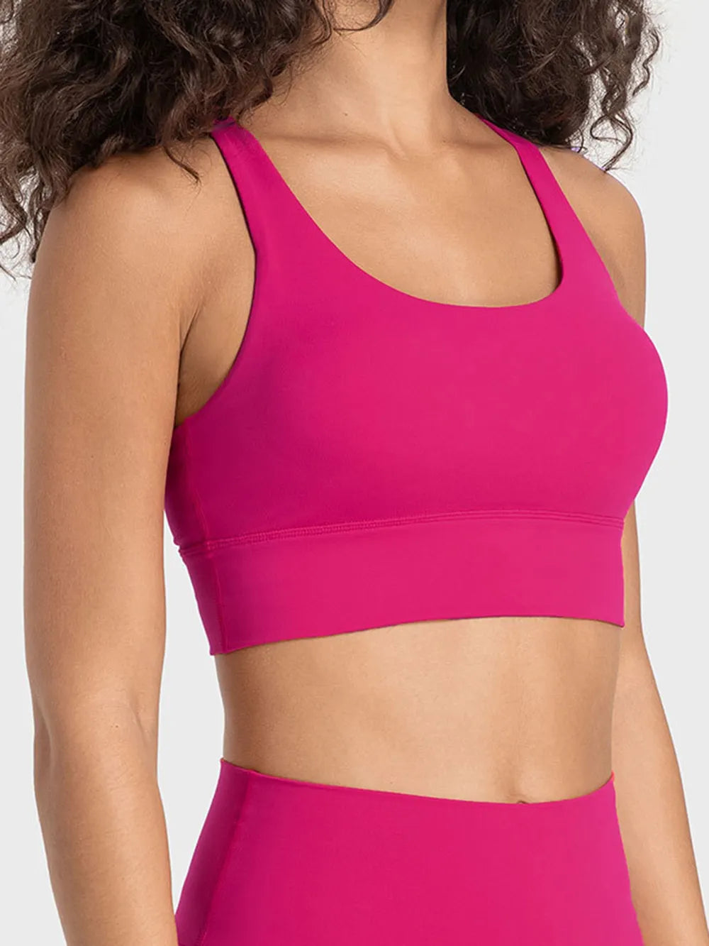 Hot pink crisscross scoop-neck active tank top with sporty stretch fabric
