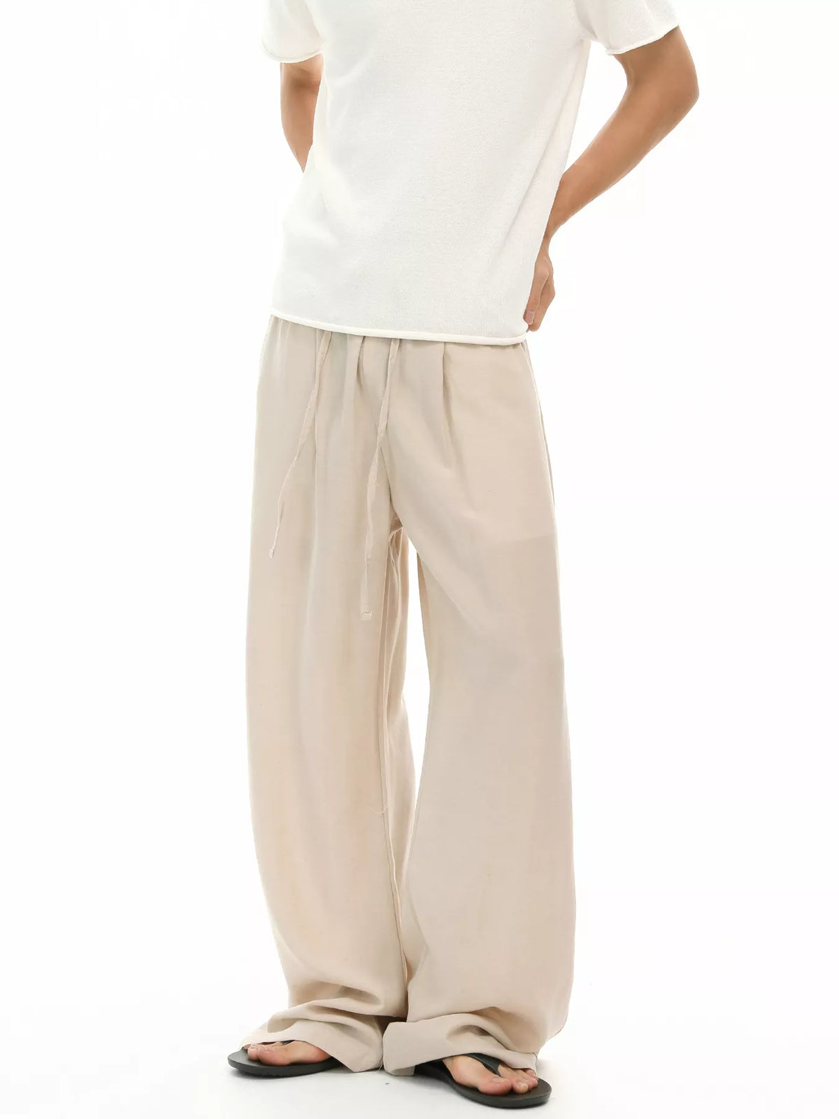 Light khaki relaxed wide-leg pants with elastic waistband and drawstring