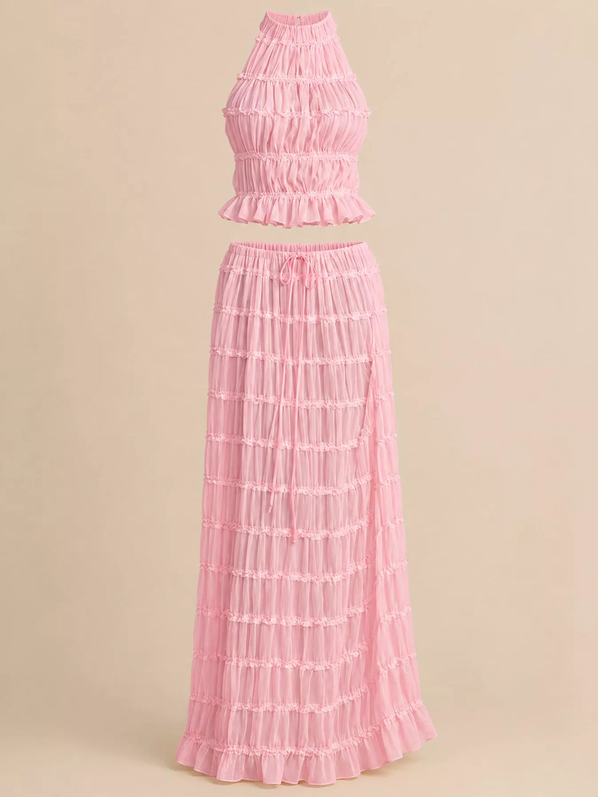 Pink halter neck ruffle crop top with layered maxi skirt set