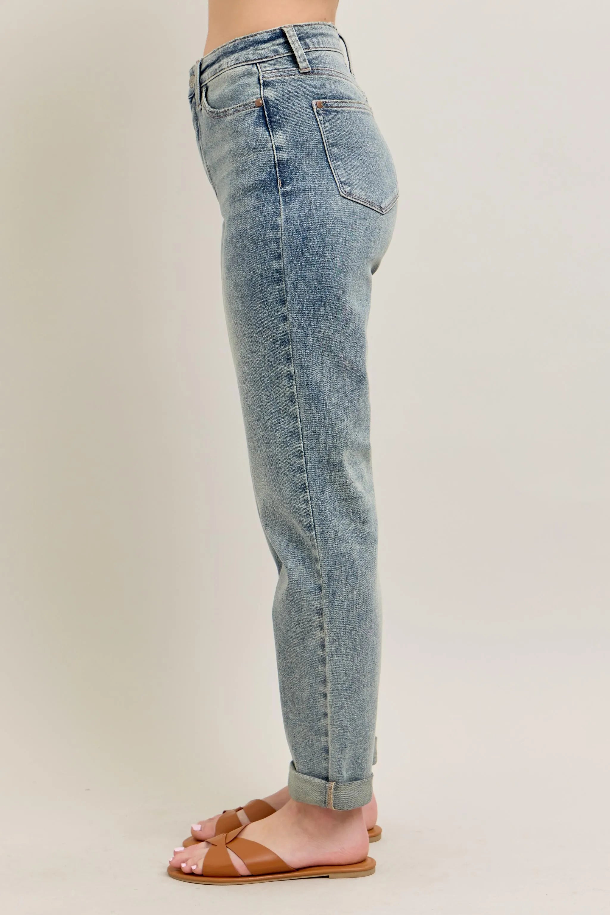 Light blue vintage-wash jeans side profile with double roll cuff