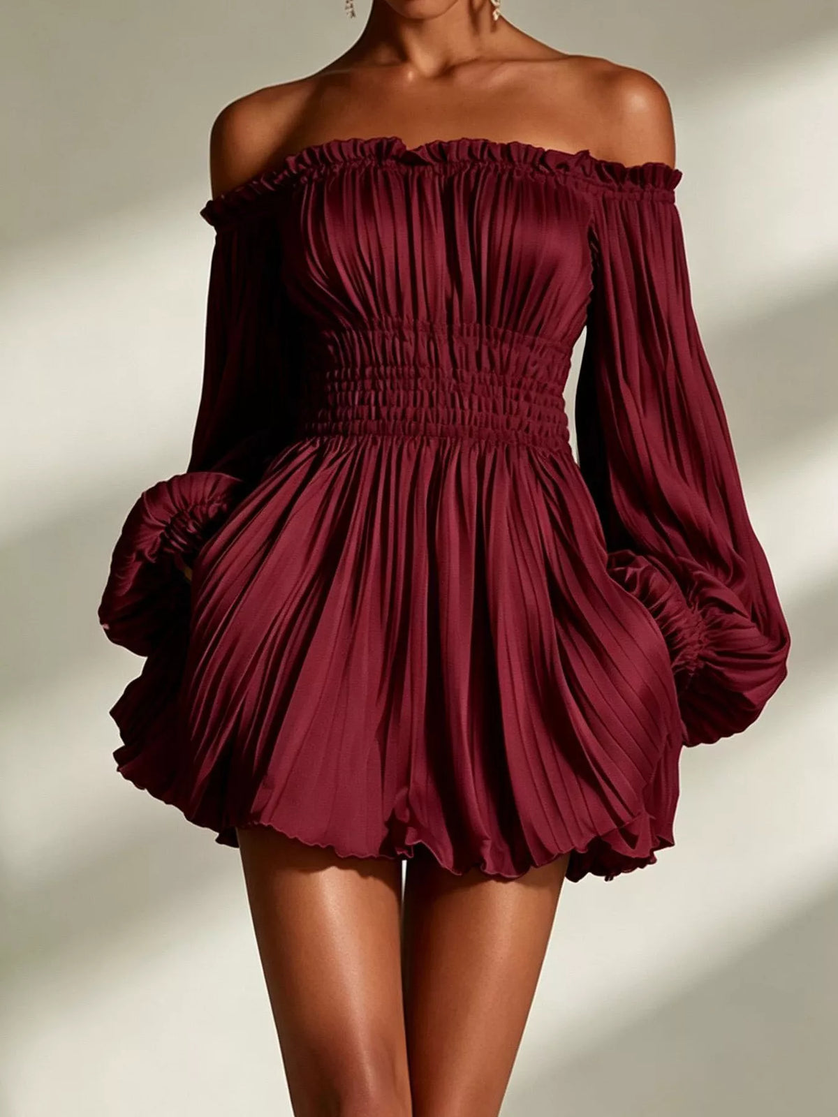 Burgundy off-shoulder pleated mini dress with smocked bodice and long puff sleeves