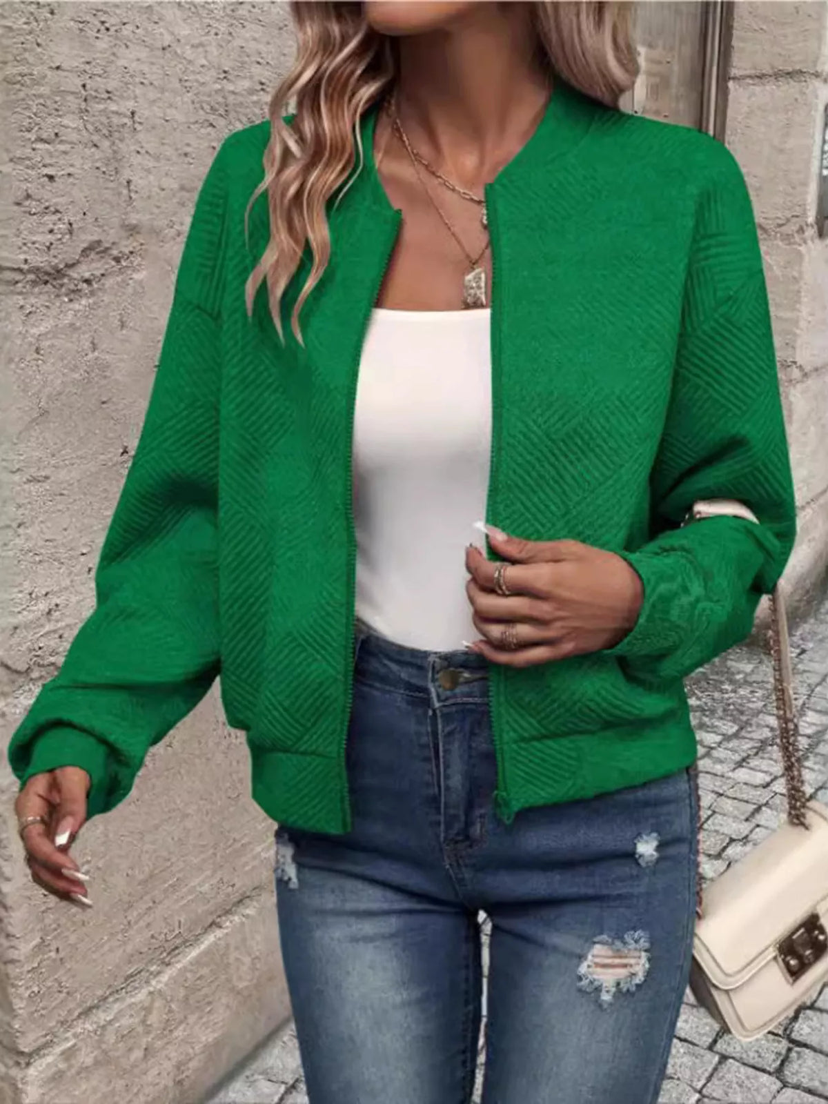 Green textured knit zip-up jacket with pockets, front zipper, and long sleeves