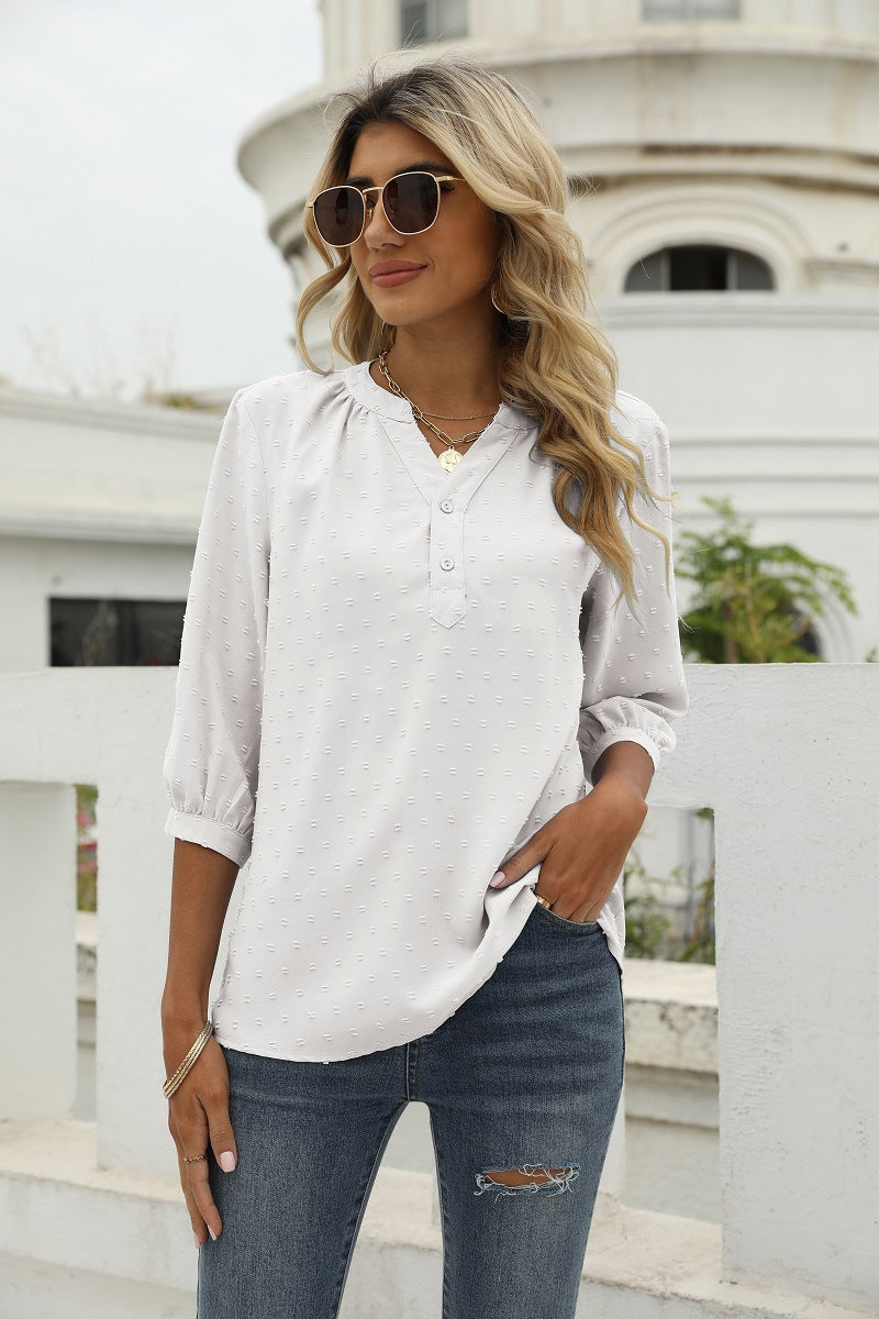 White swiss dot notched-neck 3/4-sleeve blouse with button placket