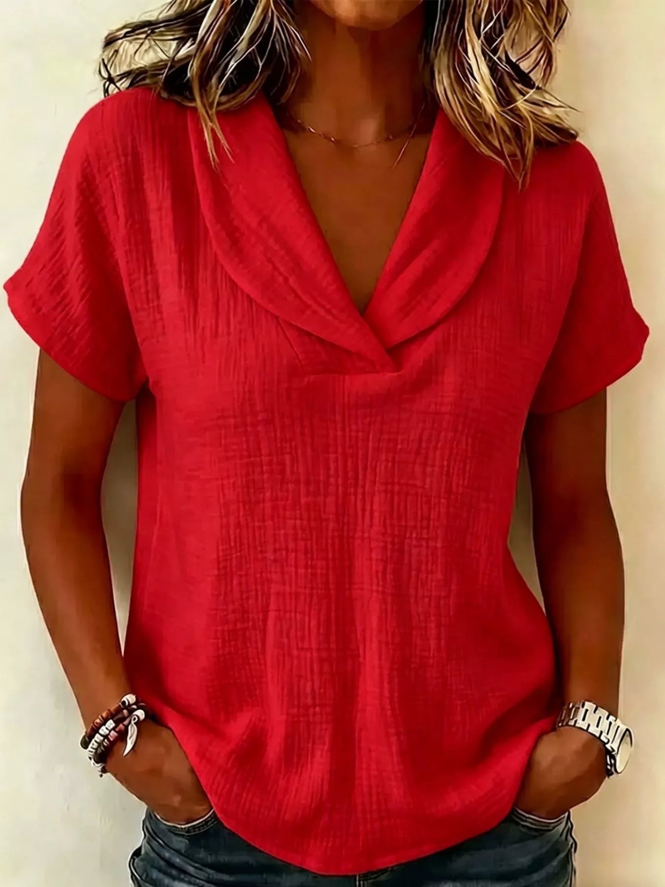 Red textured short-sleeve blouse with V-neck and relaxed fit