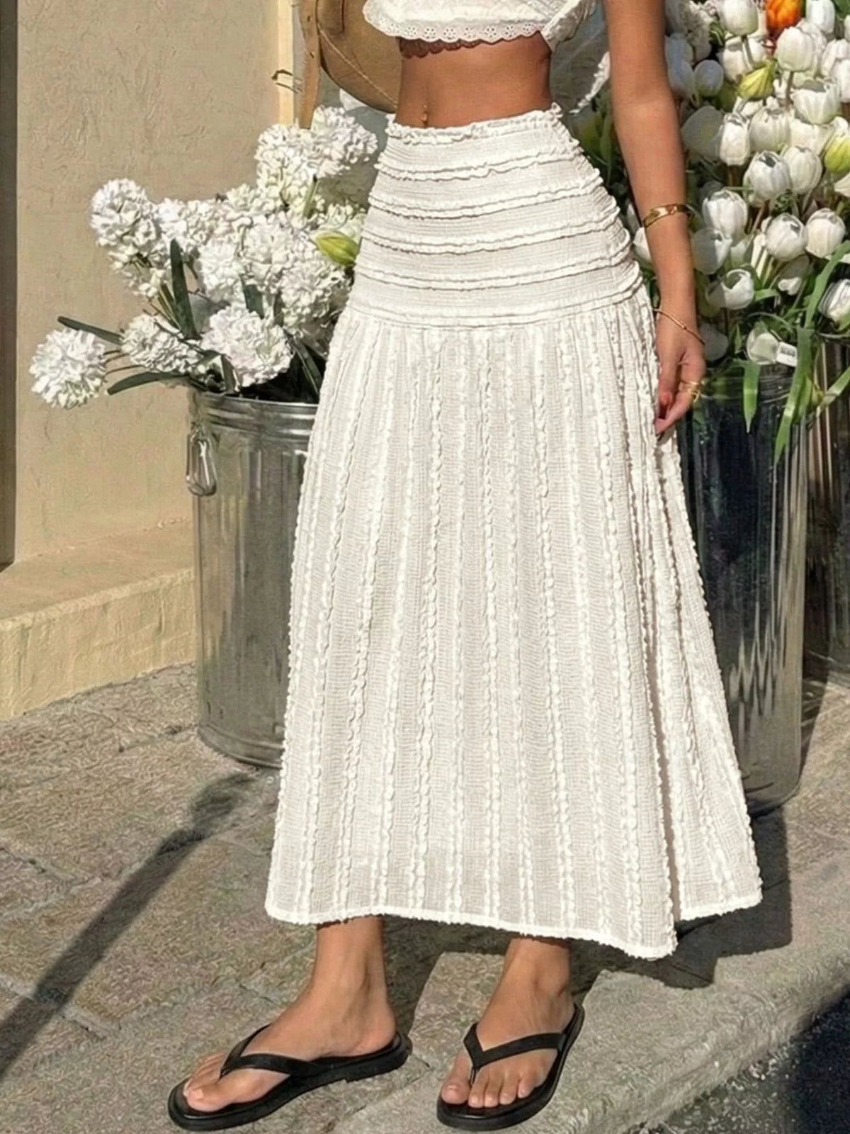 Ivory textured midi skirt with gathered waist and flared tiered ruffle construction