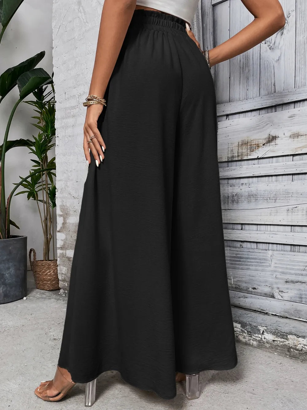 Black high waist wide-leg pants with elastic waistband and drawstring ties
