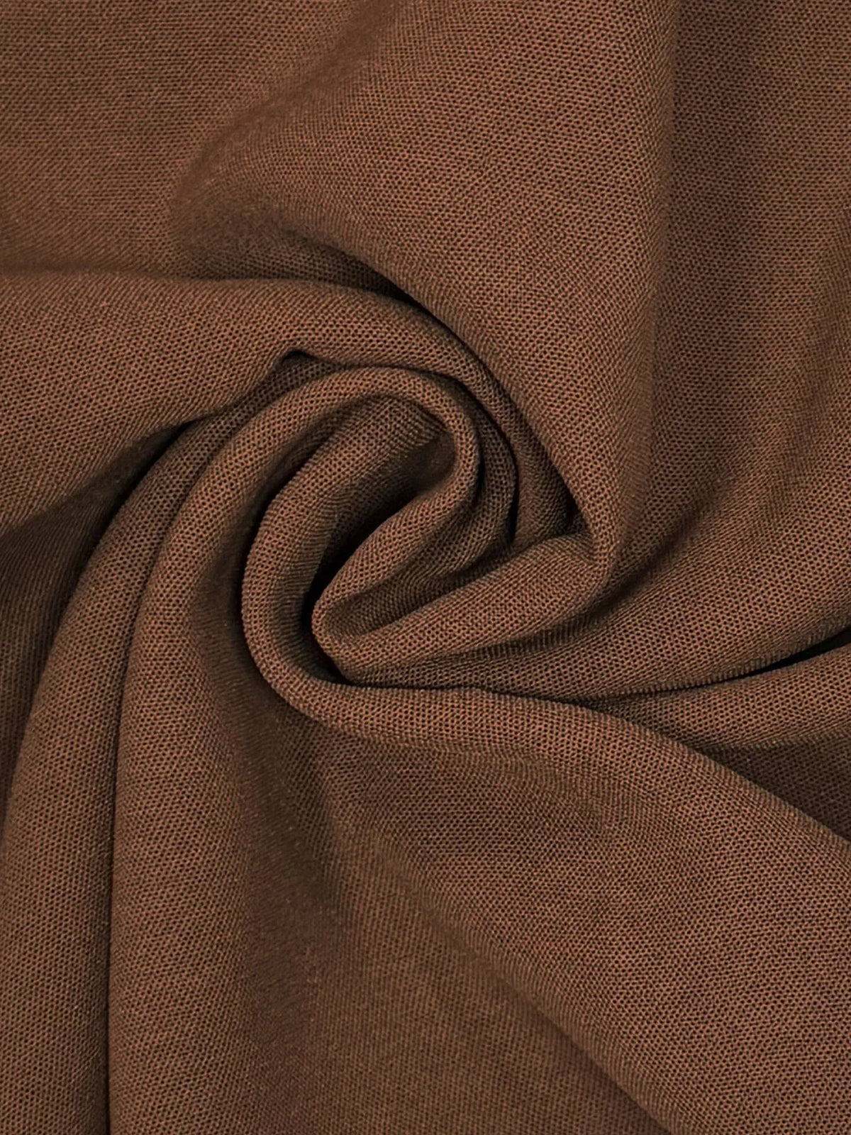 Brown textured woven fabric close-up for halter neck smocked jumpsuit