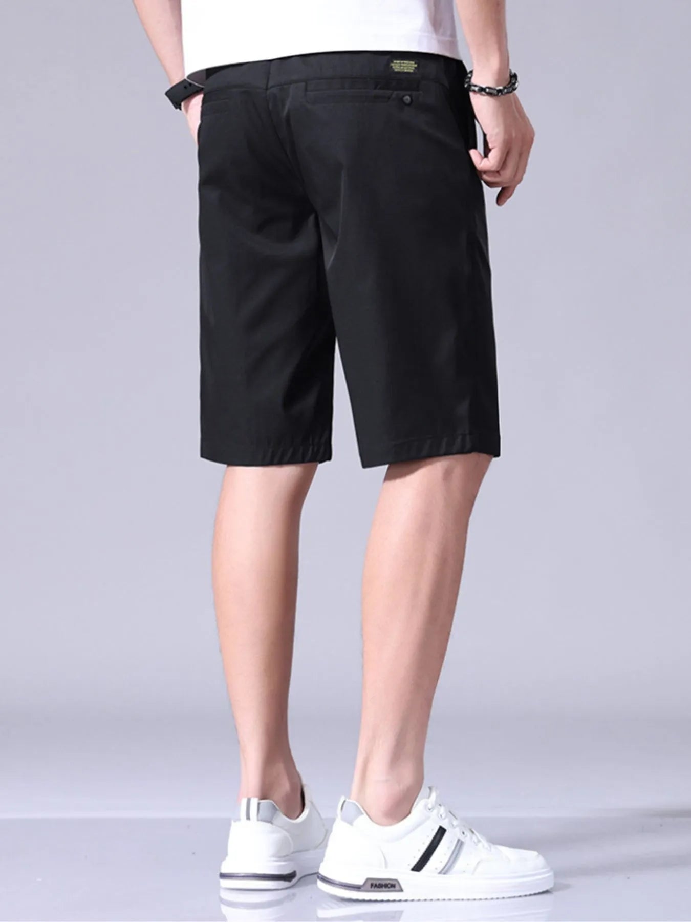 Black men's casual shorts with pockets, belt loops, and button closure
