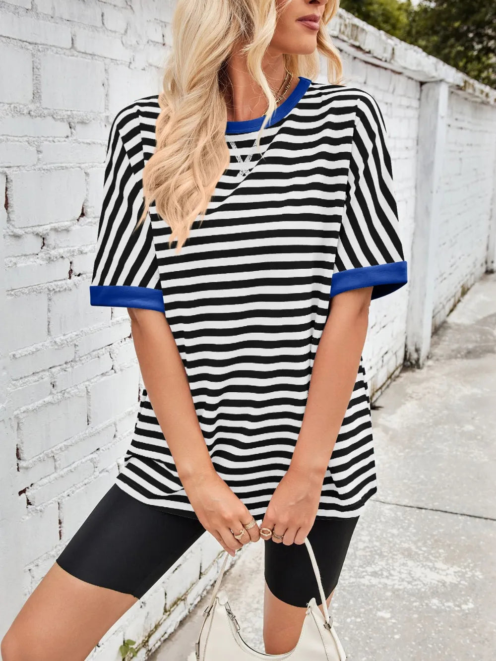 Striped round-neck half-sleeve T-shirt in black with white stripes and blue trim
