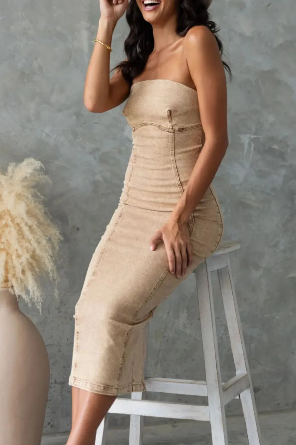 Tan washed denim tube dress with strapless bodice and midi back slit
