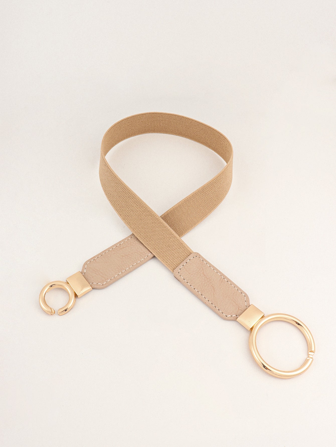 Beige elastic vegan leather belt with gold-toned double-ring buckle and end tab