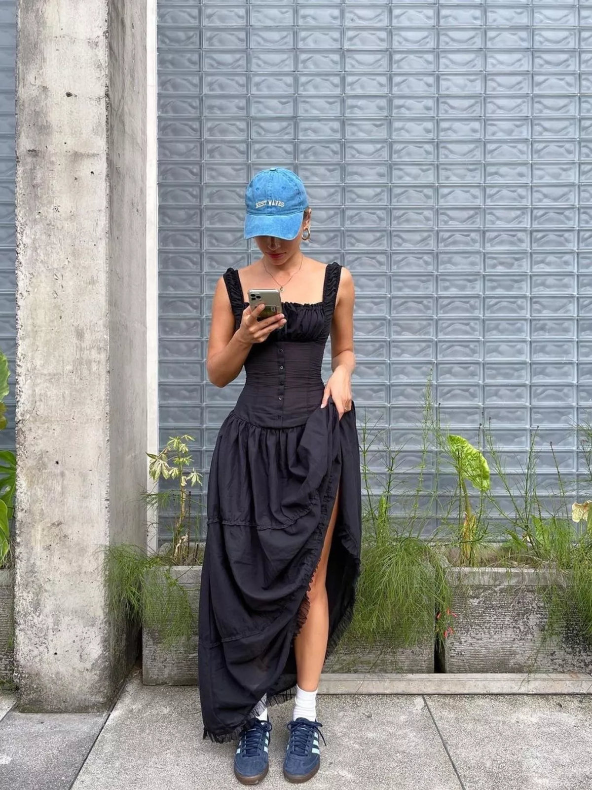 Black square-neck tiered maxi dress with ruffled tiers and buttoned bodice