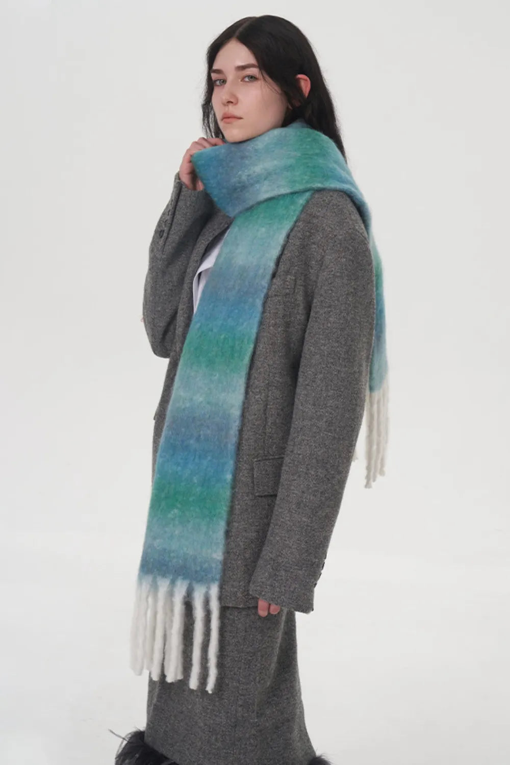 Blue-green gradient thermal scarf with fuzzy texture and long fringe ends.