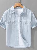 Men's short-sleeve cotton button-up shirt, light blue, chest pockets and button front