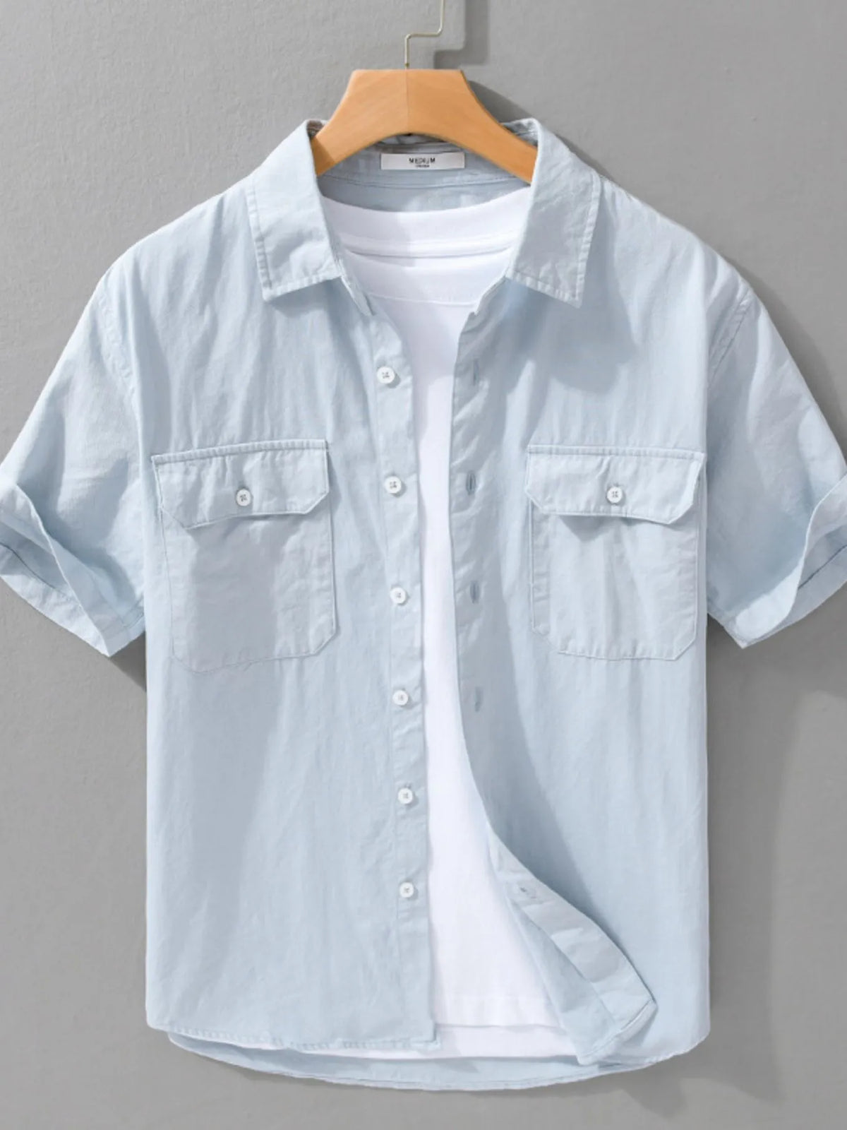 Men's short-sleeve cotton button-up shirt, light blue, chest pockets and button front