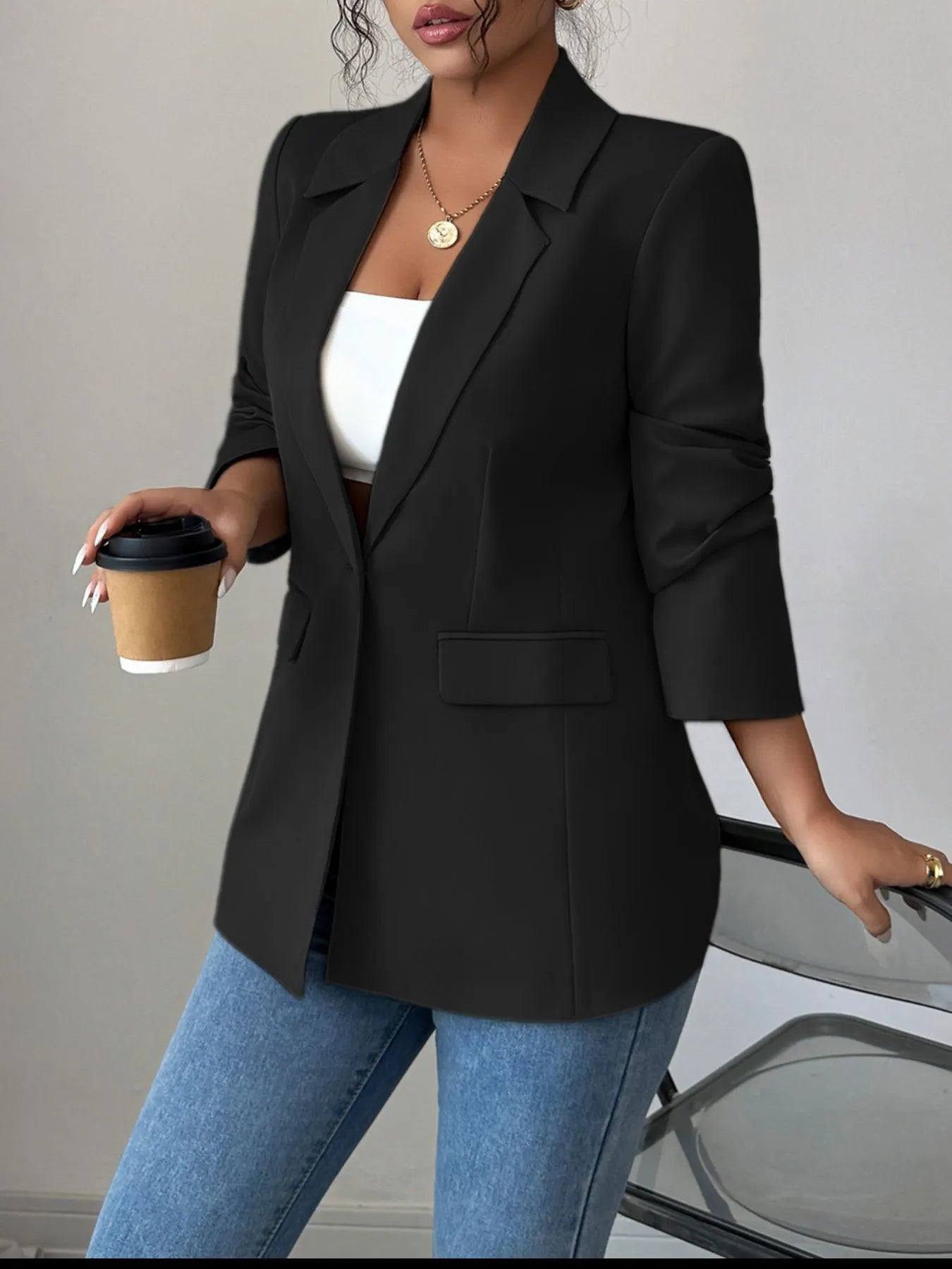 Black one-button lapel blazer with chest flap pocket and 3/4 sleeves