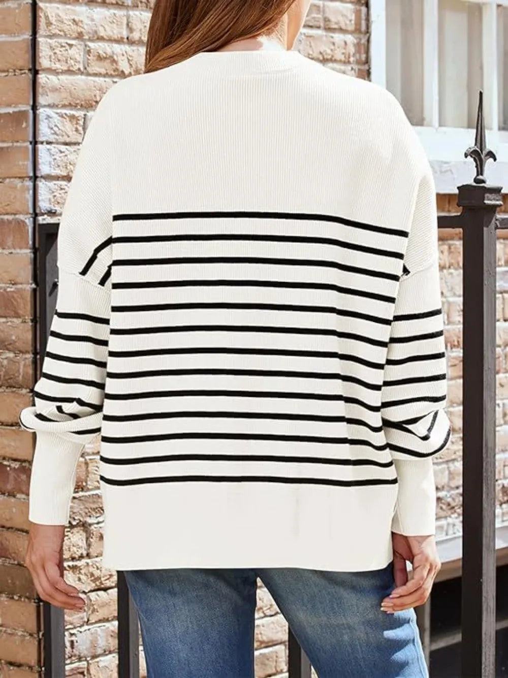 Back view tan sweatshirt with round neck and black stripe band across shoulders