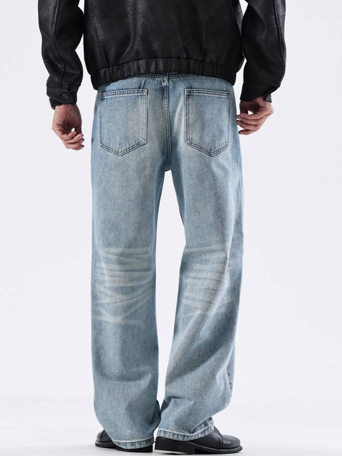 Washed sky-blue wide-leg jeans with belt loops and front patch pockets